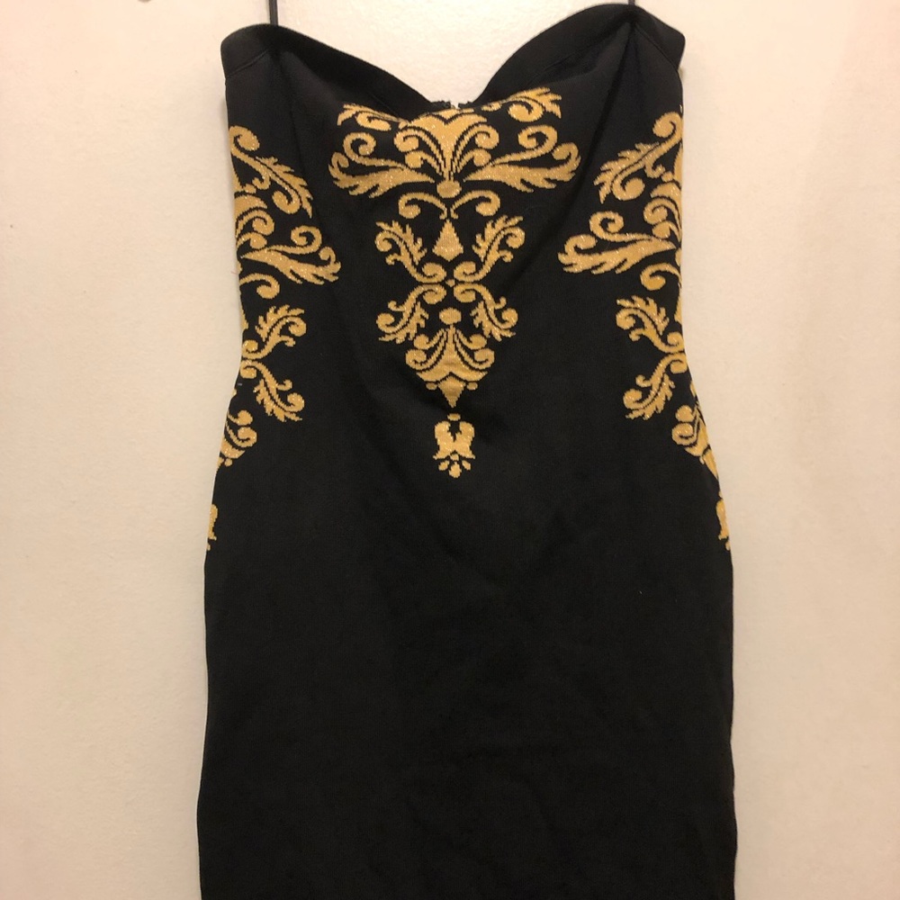 Bebe sexy black/gold bodycon dress...above knee
